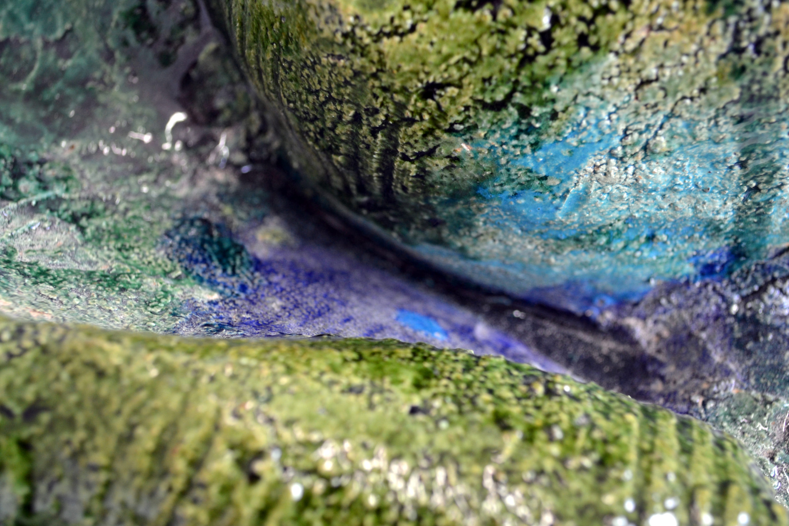 Detail of the sculpture "Corps Paysage #1" by Barbara Bauer artist, with green and blue glazing